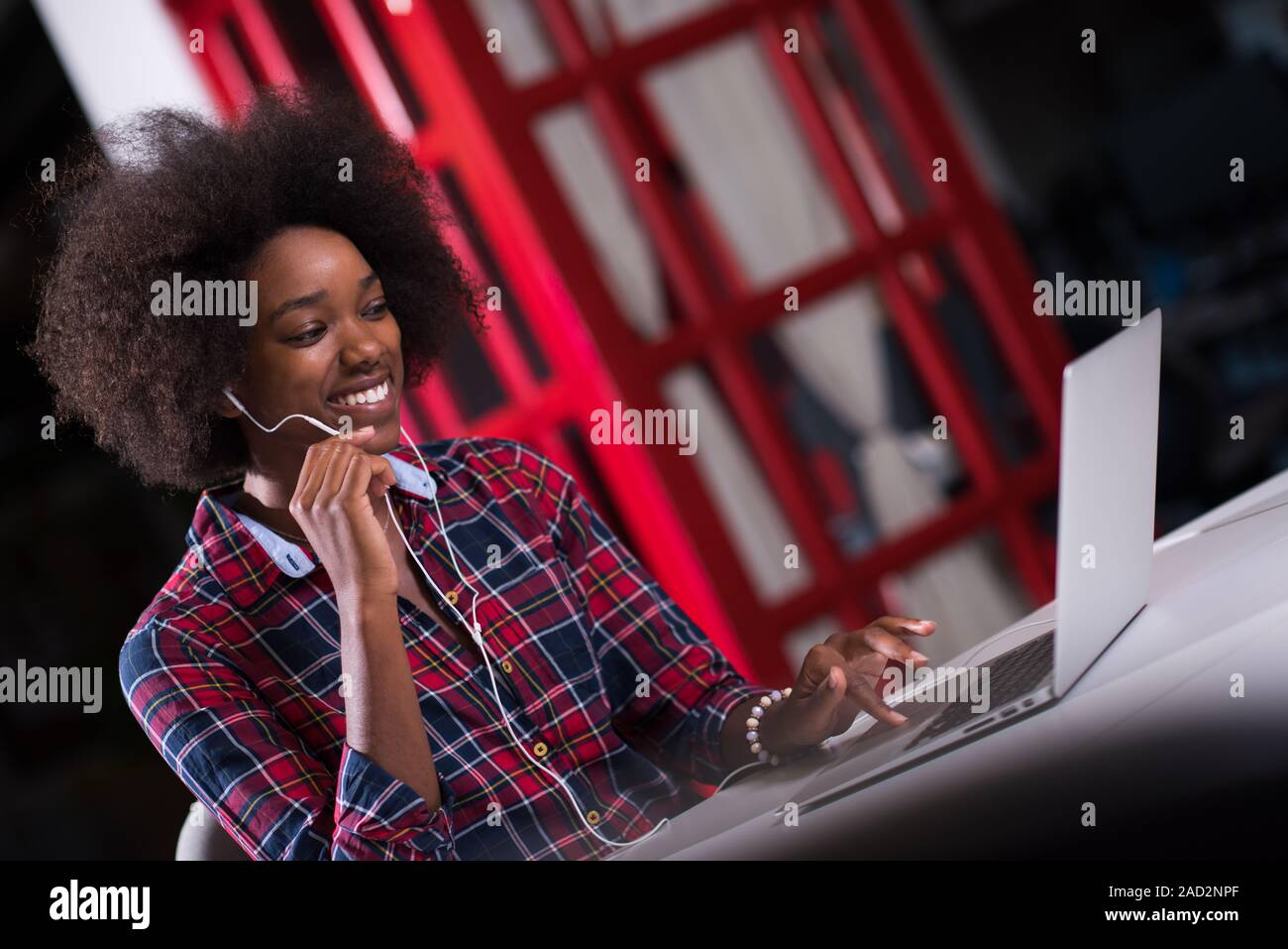 portrait of a young successful African-American woman in modern office ...