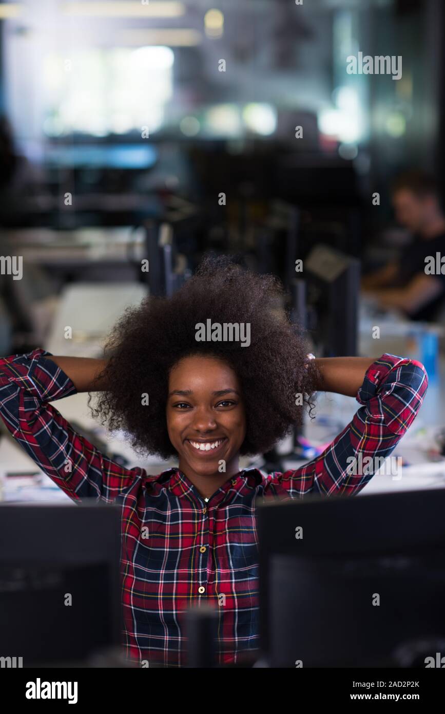 portrait of a young successful African-American woman in modern office ...