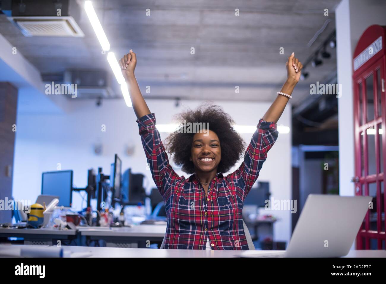 portrait of a young successful African-American woman in modern office ...