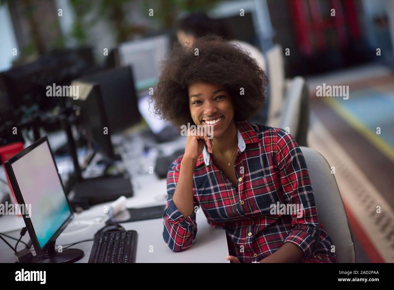 portrait of a young African American woman in modern office Stock Photo ...