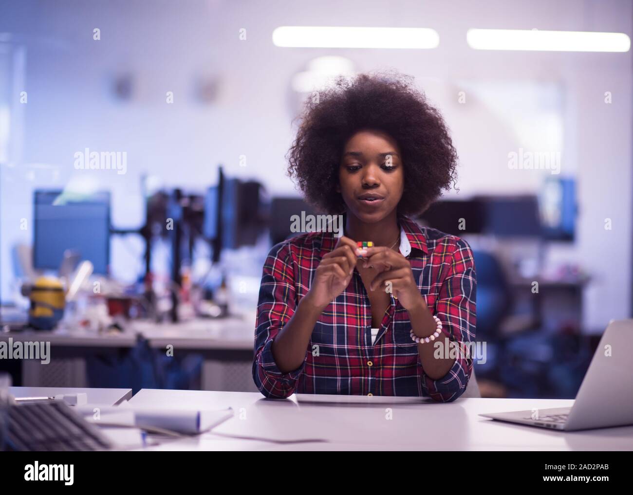 portrait of a young successful African-American woman in modern office ...