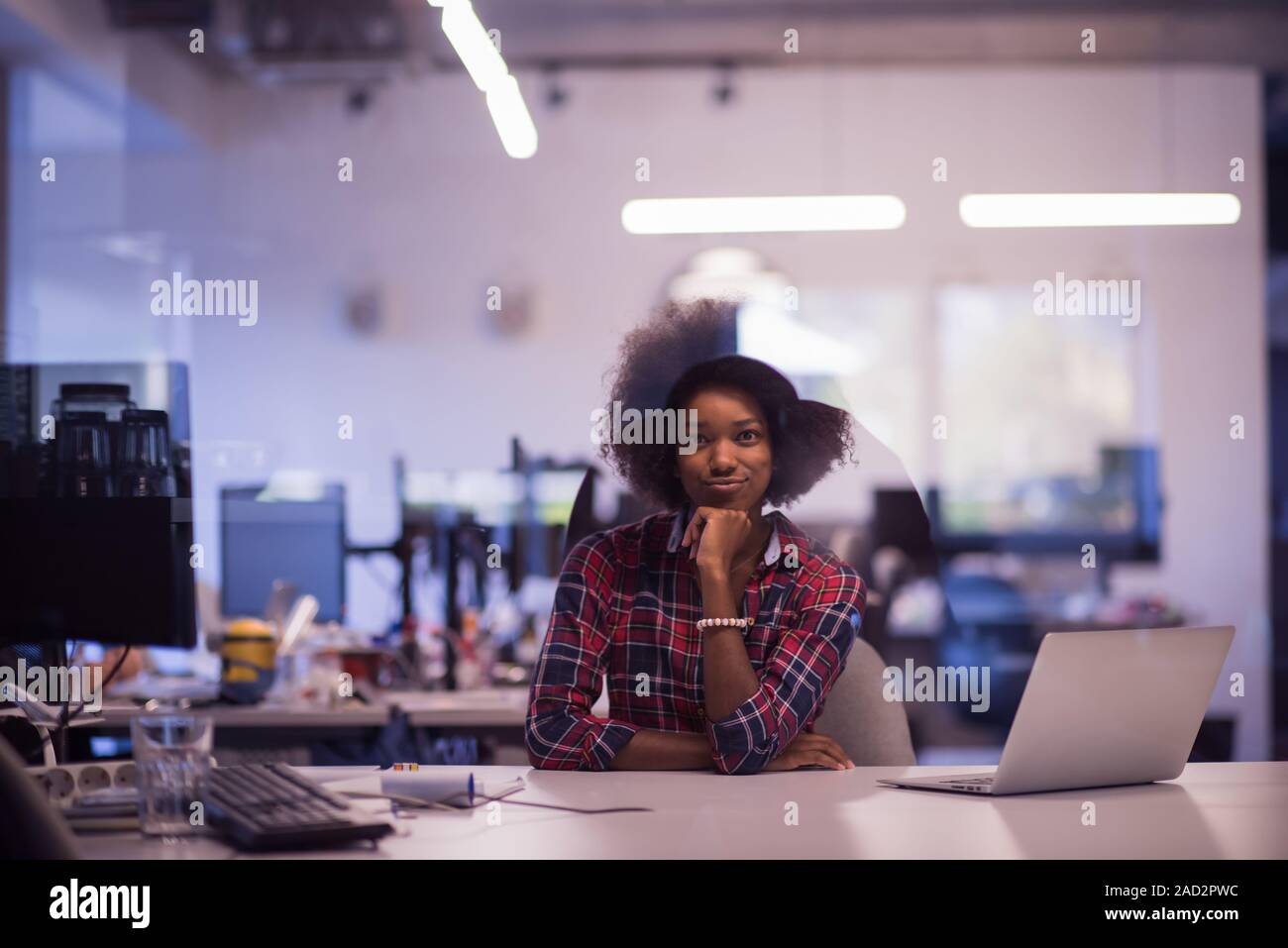 portrait of a young successful African-American woman in modern office ...
