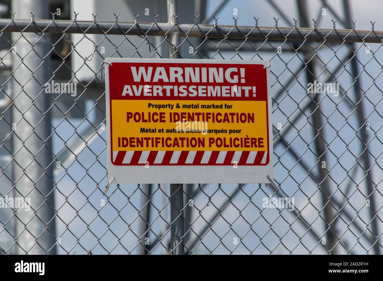 two languages French and English Warning Signage, property and metal