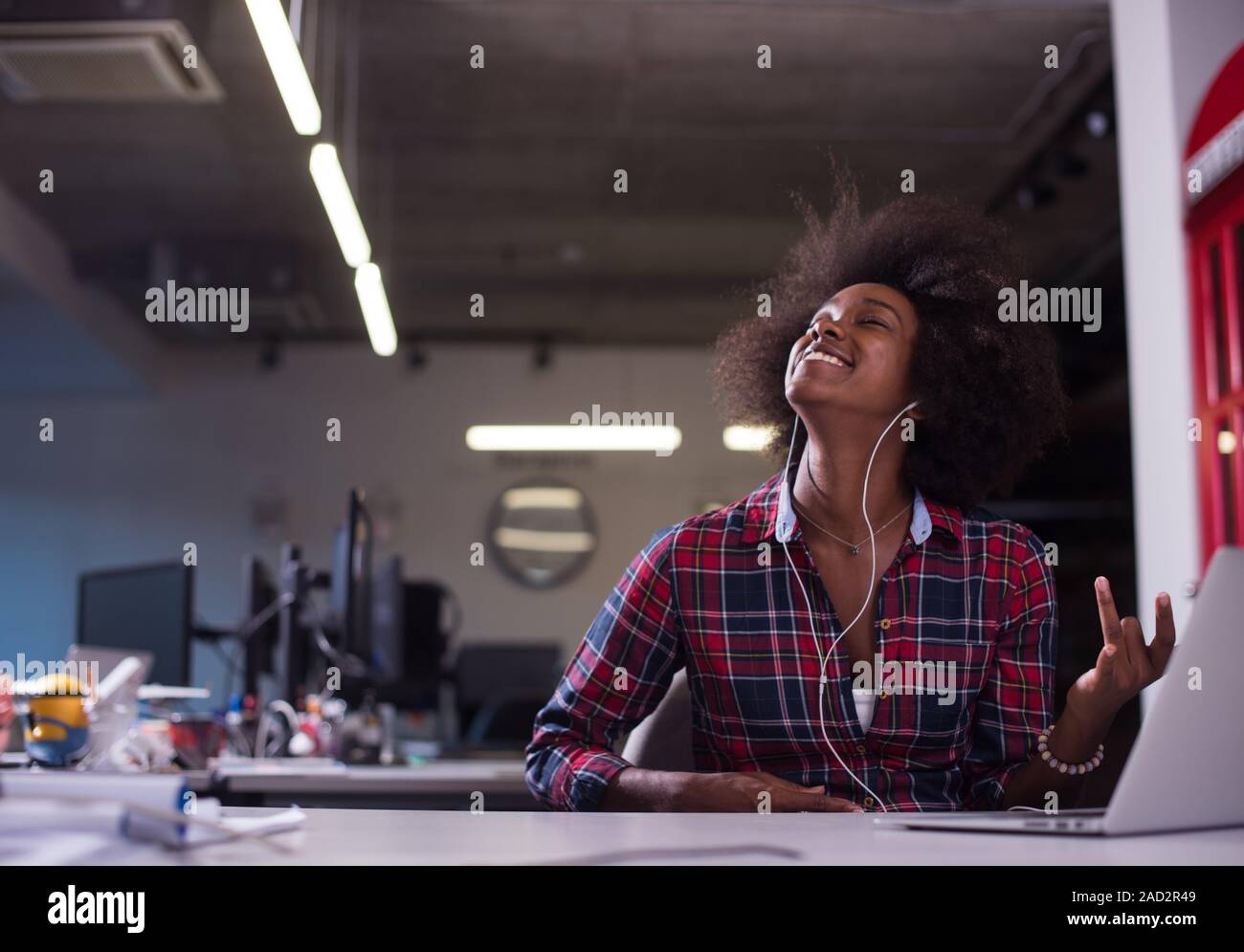 portrait of a young successful African-American woman in modern office ...
