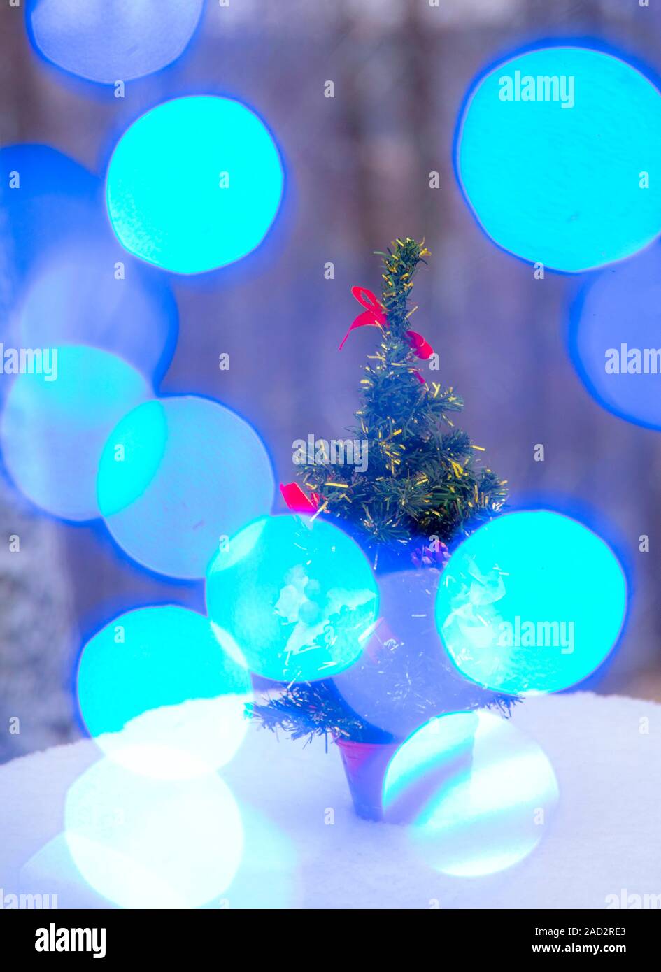 Artificial Christmas tree on a stump in the winter forest Stock Photo Alamy