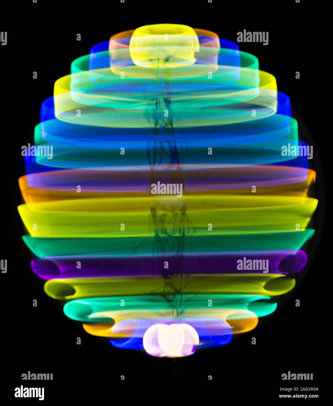 Multicoloured spinning light trails. Stock Photo