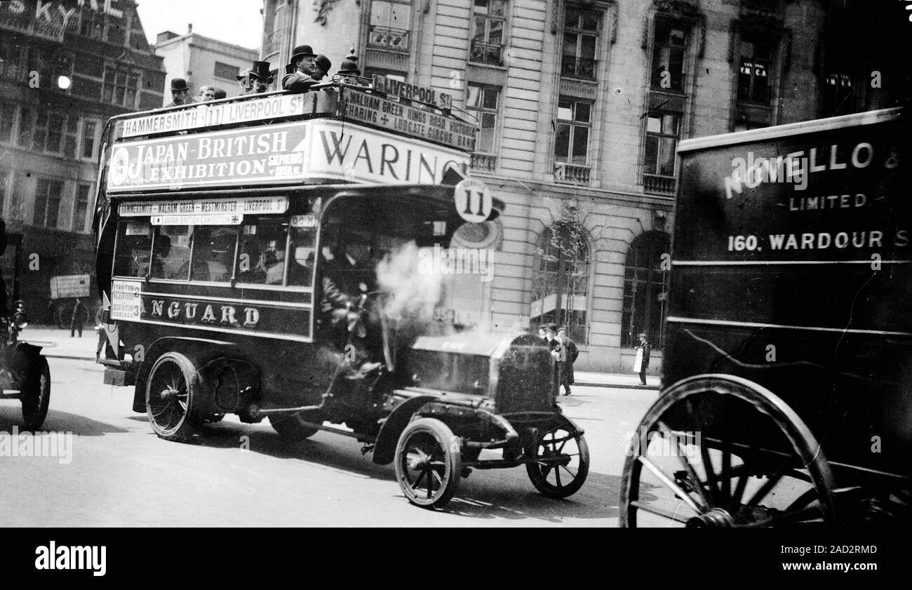 London motor bus. Early 20th century London motor bus operated by the Vanguard company. The adverts on the side of the top deck of the bus includes on Stock Photo