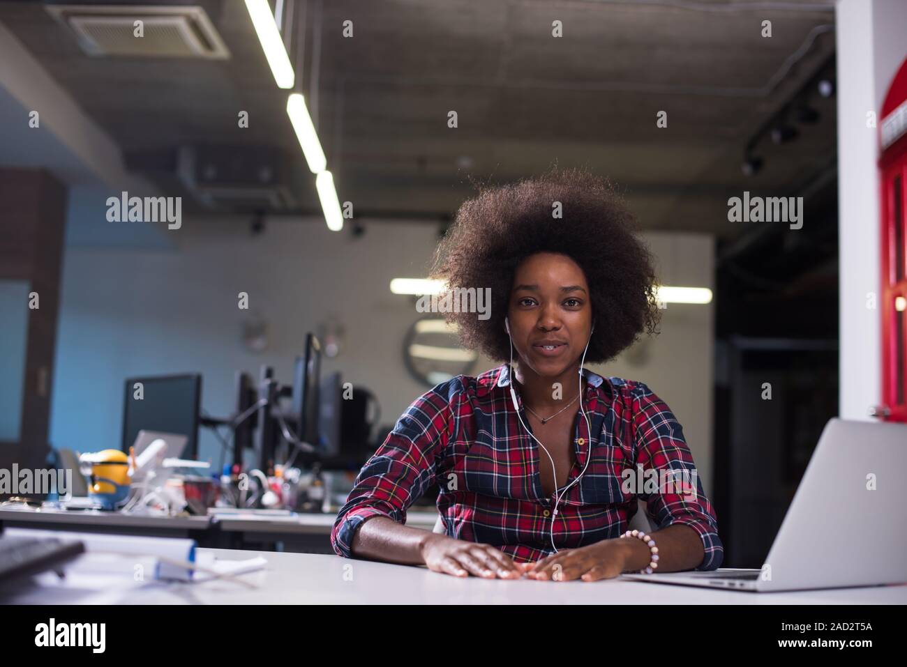 portrait of a young successful African-American woman in modern office ...