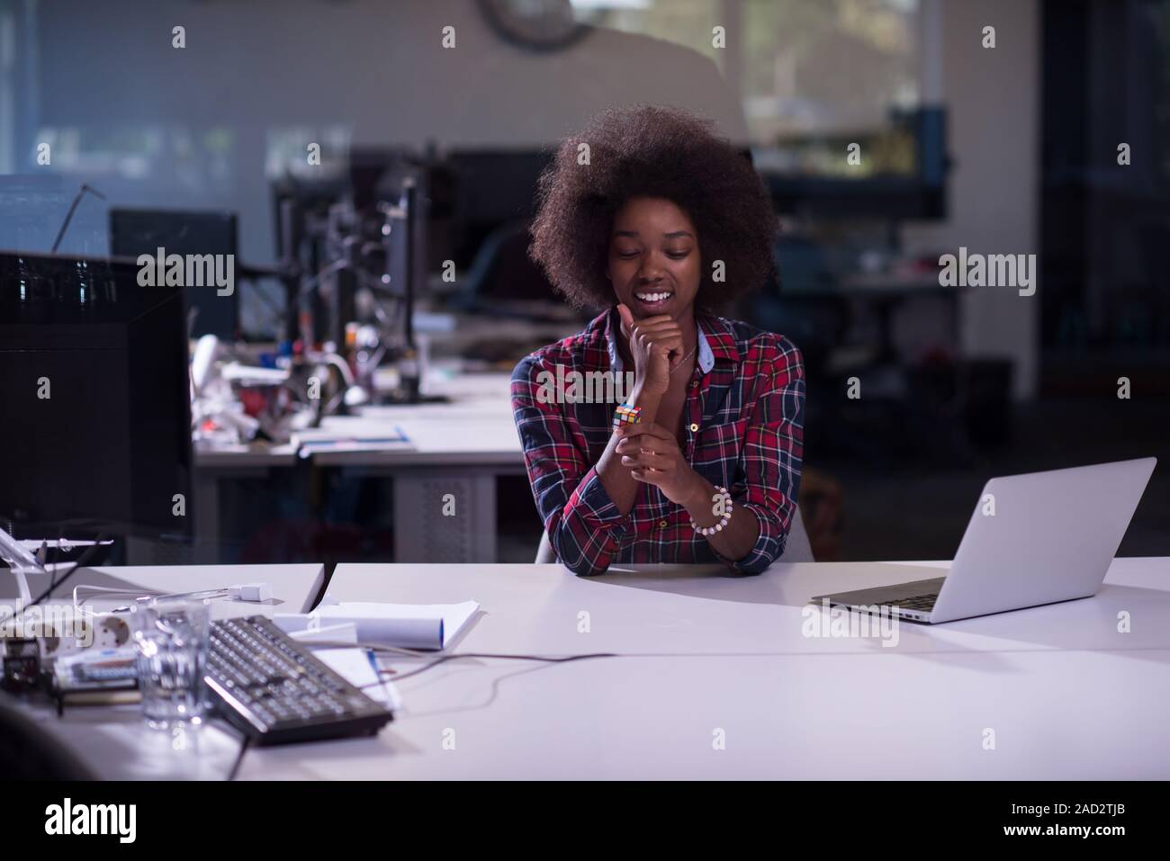 portrait of a young successful African-American woman in modern office ...