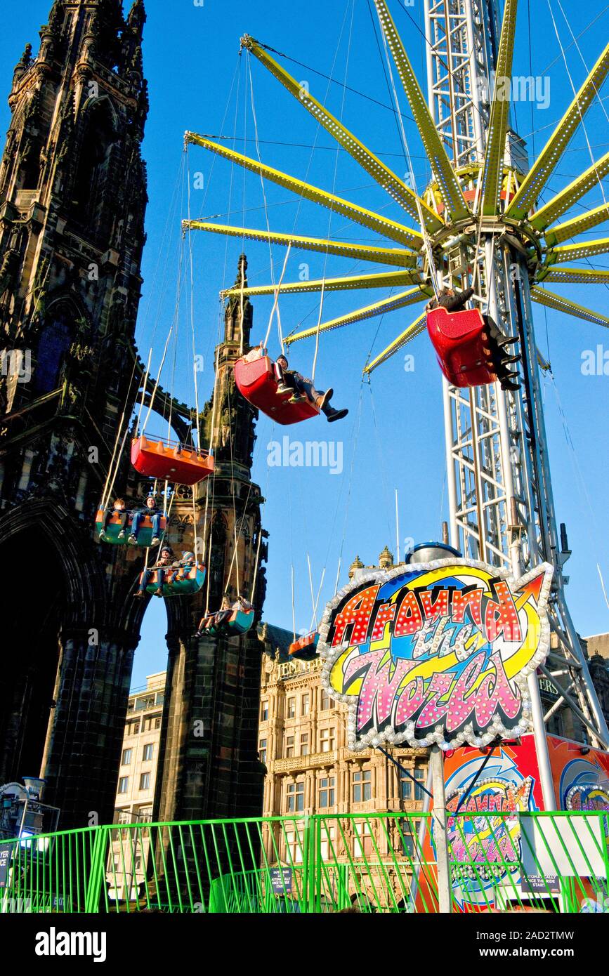 Walter Scott Monument and high Star Flyer fairground ride. Edinburgh