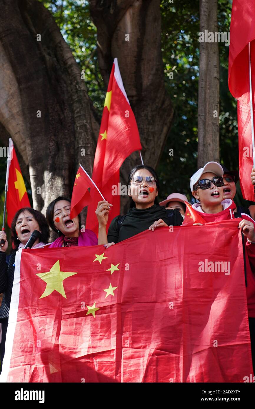 Hong Kong, China. 3rd Dec, 2019. People protest against the United States' intervention in Hong Kong affairs in front of the U.S. Consulate General, south China, Dec. 3, 2019. Nearly 100 people gathered Tuesday afternoon at Chater Garden in Central Hong Kong to protest against the U.S. administration's signing of the so-called Hong Kong Human Rights and Democracy Act of 2019 into law. Credit: Wang Shen/Xinhua/Alamy Live News Stock Photo