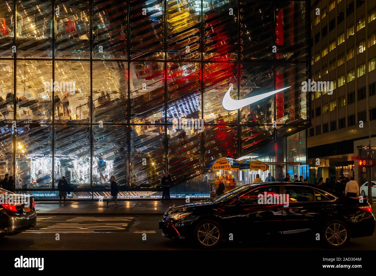 Shoppers and visitors outside the newly opened Nike “House of Innovation” flagship store on Fifth avenue in New York on Tuesday, November 26, 2019. (© Richard B. Levine) Stock Photo