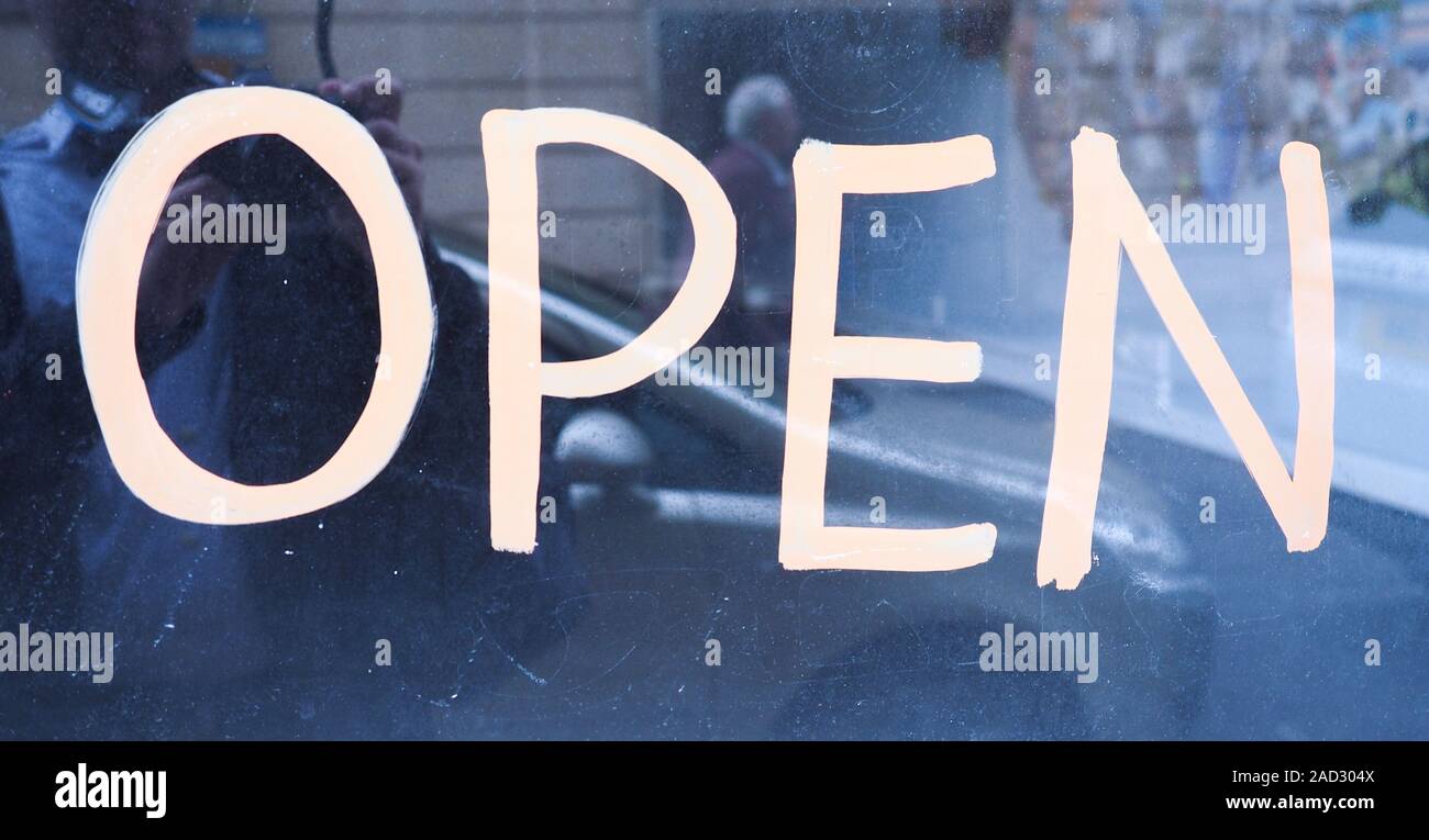 Open sign on storefront Stock Photo - Alamy