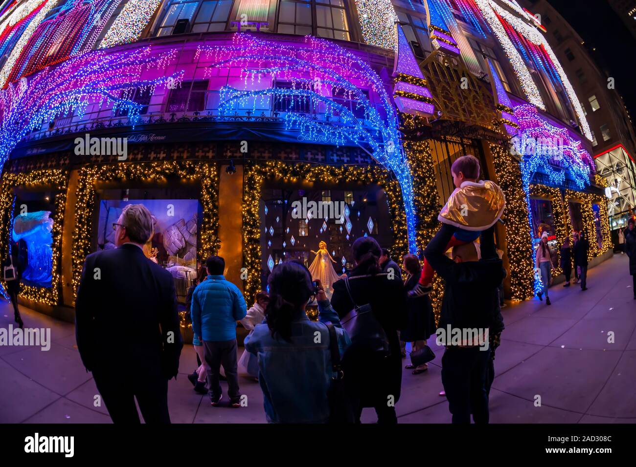 Shoppers at the Christmas windows of Saks Fifth Avenue on Fifth Avenue