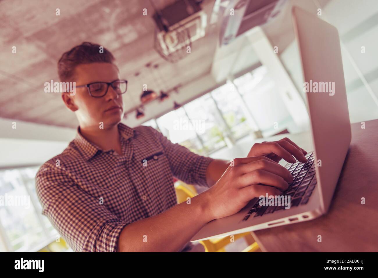 young  man working on laptop Stock Photo
