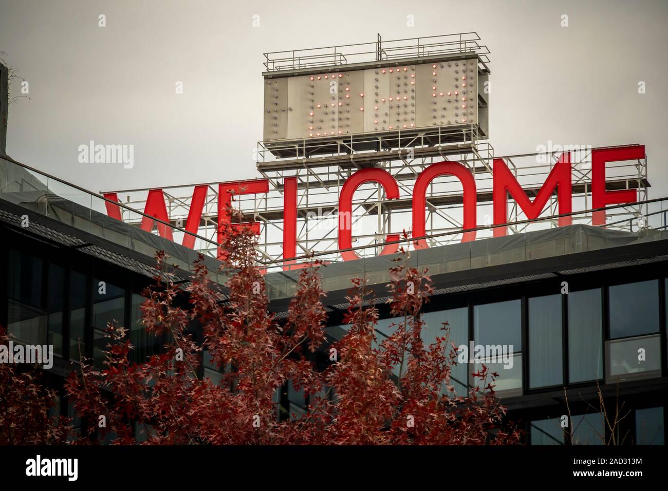 The former Jehovah’s Witnesses headquarters which once supported a huge Watchtower sign, has the sign replaced with “Welcome”, visible to all entering Brooklyn, in New York on Wednesday, November 27, 2019.  © Richard B. Levine) Stock Photo