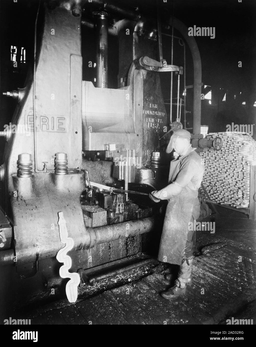 Steam hammer, 1920s. Industrial worker using a steam hammer capable of producing 150,000 lbs of