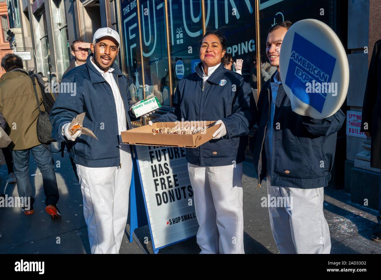 Workers outside of the American Express pop-up promote the credit card company’s Small Business Saturday in Soho in New York on Saturday, November 30, 2019. (© Richard B. Levine) Stock Photo