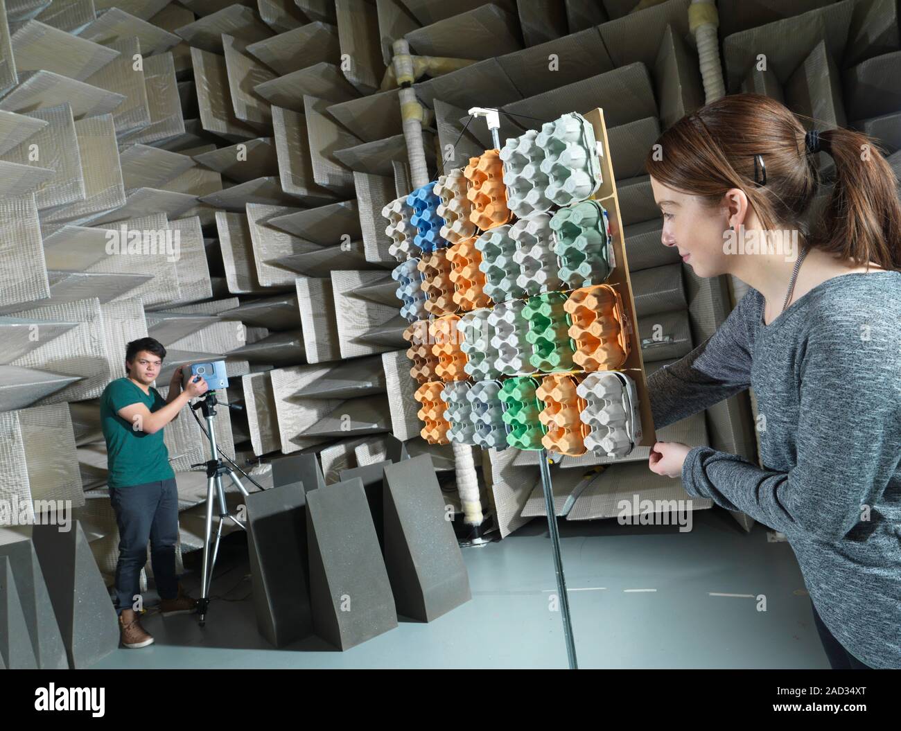 Hemianechoic chamber research. Researchers setting up equipment for an