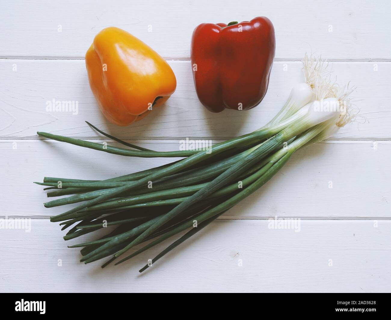 sweet pepers and scallions, top view on white wooden table Stock Photo