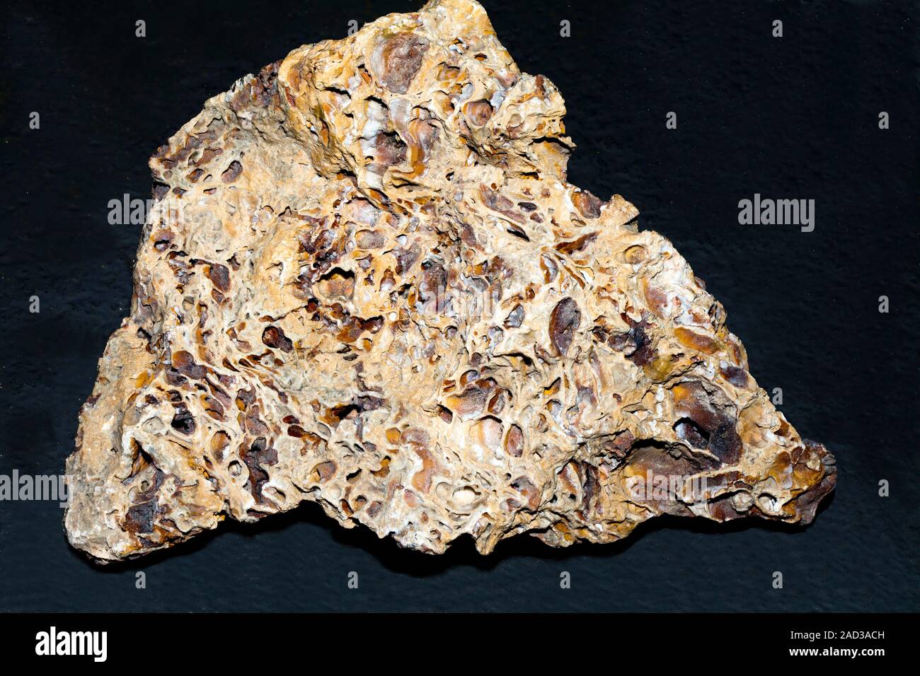 Sintering is the process whereby a material is heated to a temperature near or just under its melting point. It may happen naturally under conditions Stock Photo
