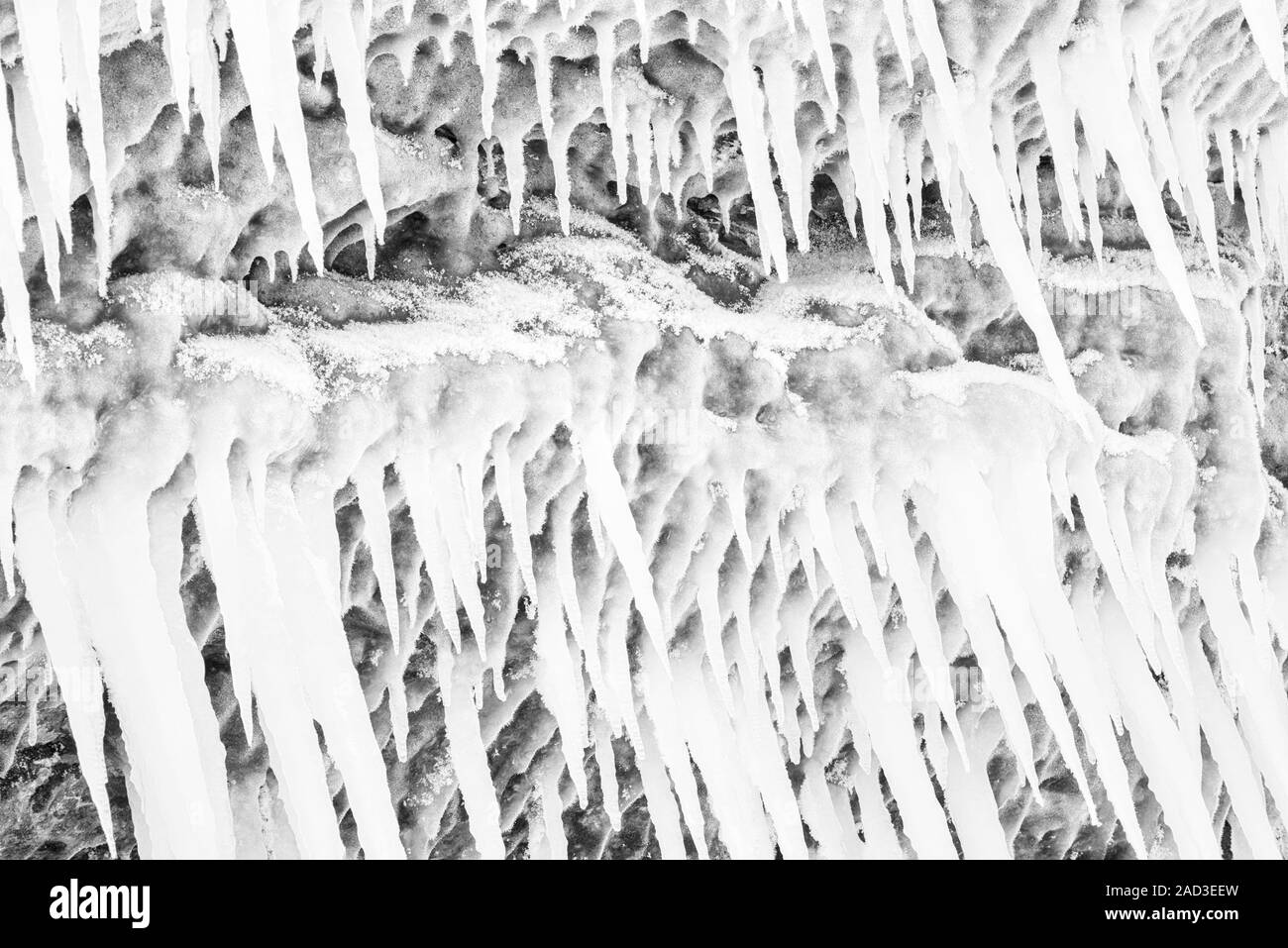 Icicles on a rock, Lake Tornetraesk, Lapland, Sweden Stock Photo