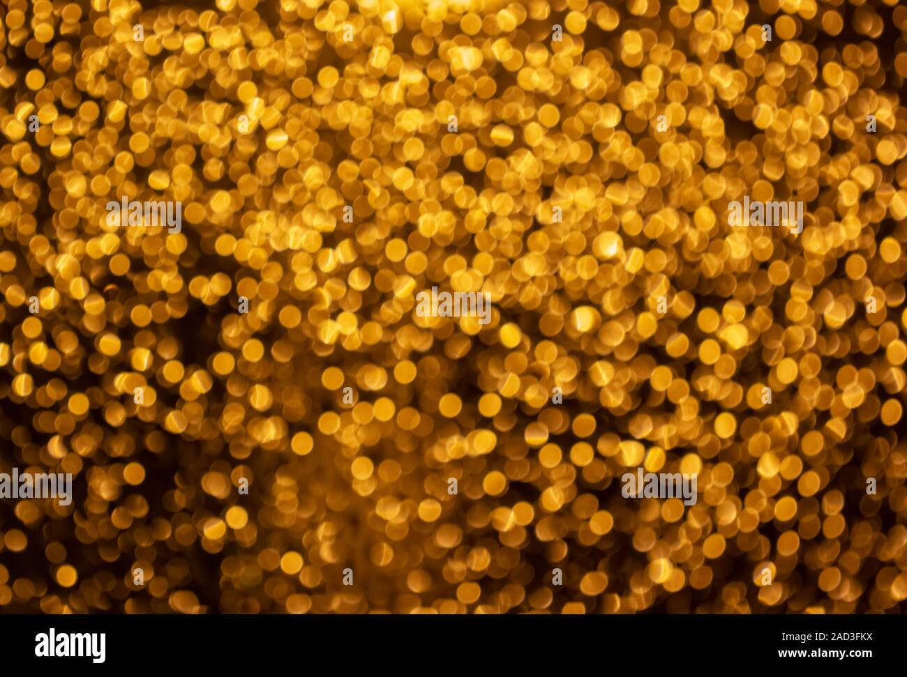 Gold christmas lights background. Abstract blurred light background. Blur bokeh Stock Photo