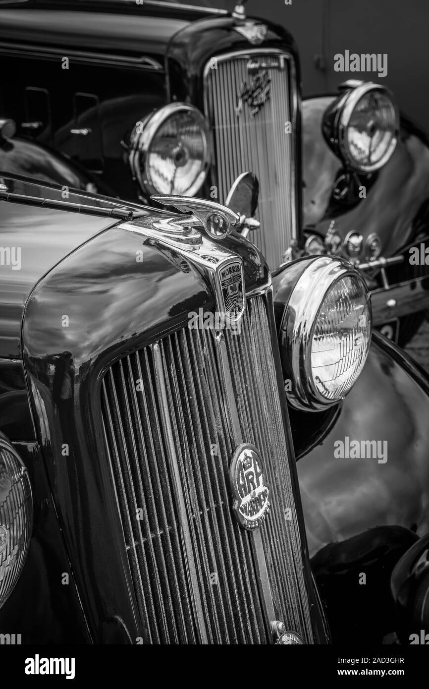 Black & white close up of classic, British, vintage motor cars Morris Twelve & Austin Six parked at 1940s, WWII wartime event, summer UK. Stock Photo
