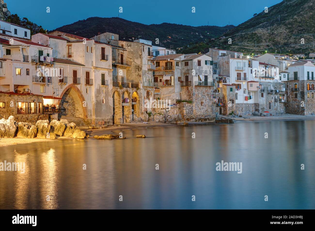 The old town of Cefalu in Sicily reaches right to the beach Stock Photo