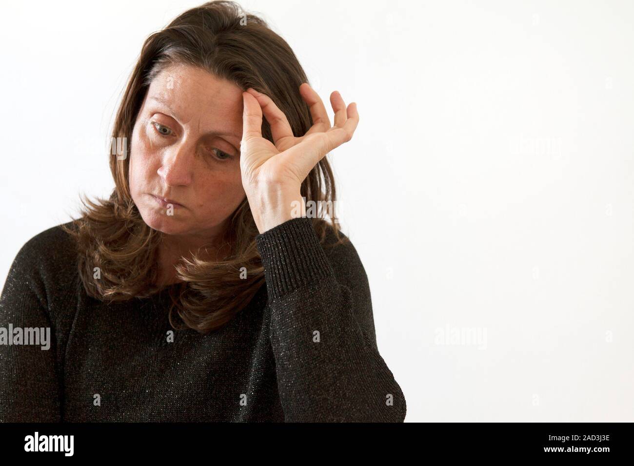 Woman pulling her hair out. Hair pulling, or trichotillomania, is a compulsive disorder where