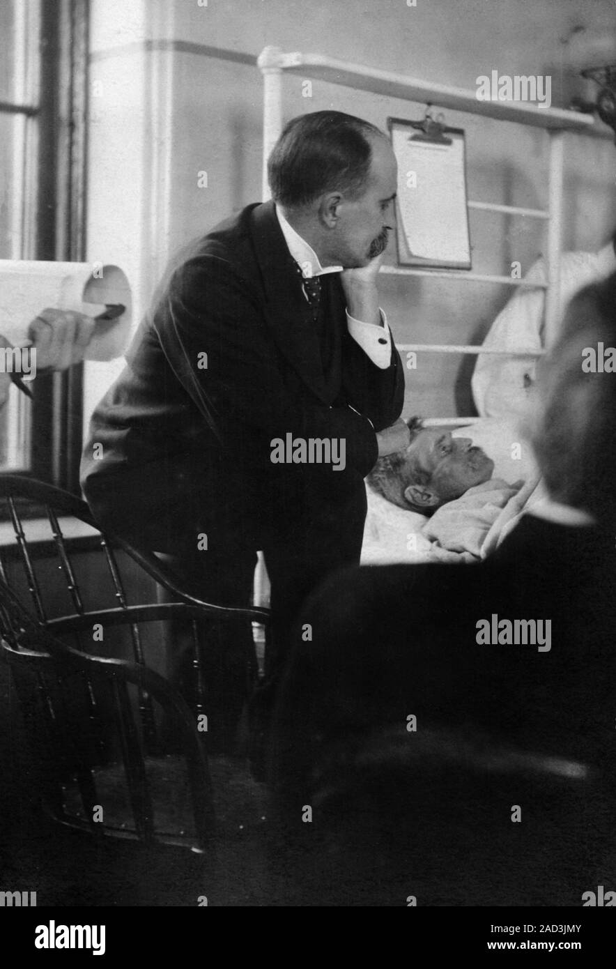 William Osler attending a patient, 1900s. Canadian physician William