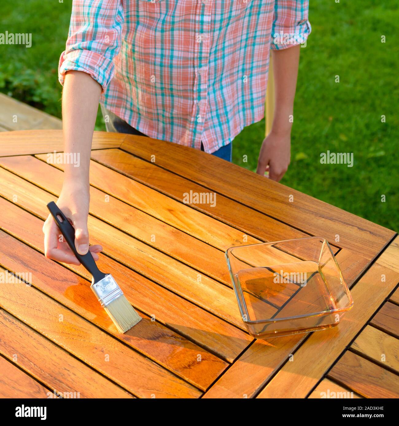 Cleaning wooden garden furniture hires stock photography and images