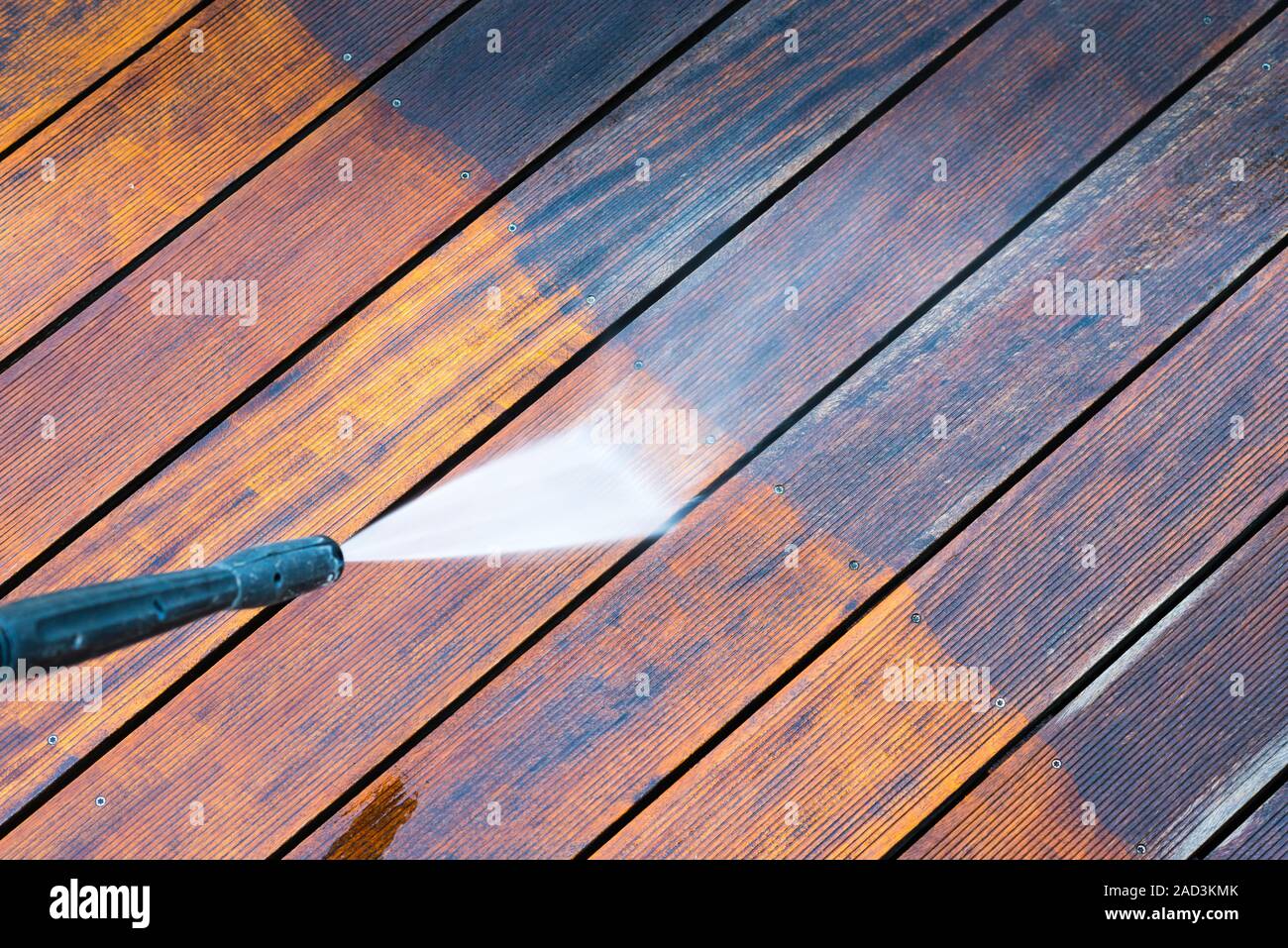 cleaning terrace with a pressure washer Stock Photo - Alamy