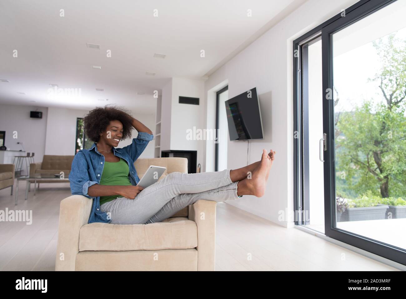african american woman at home with digital tablet Stock Photo - Alamy
