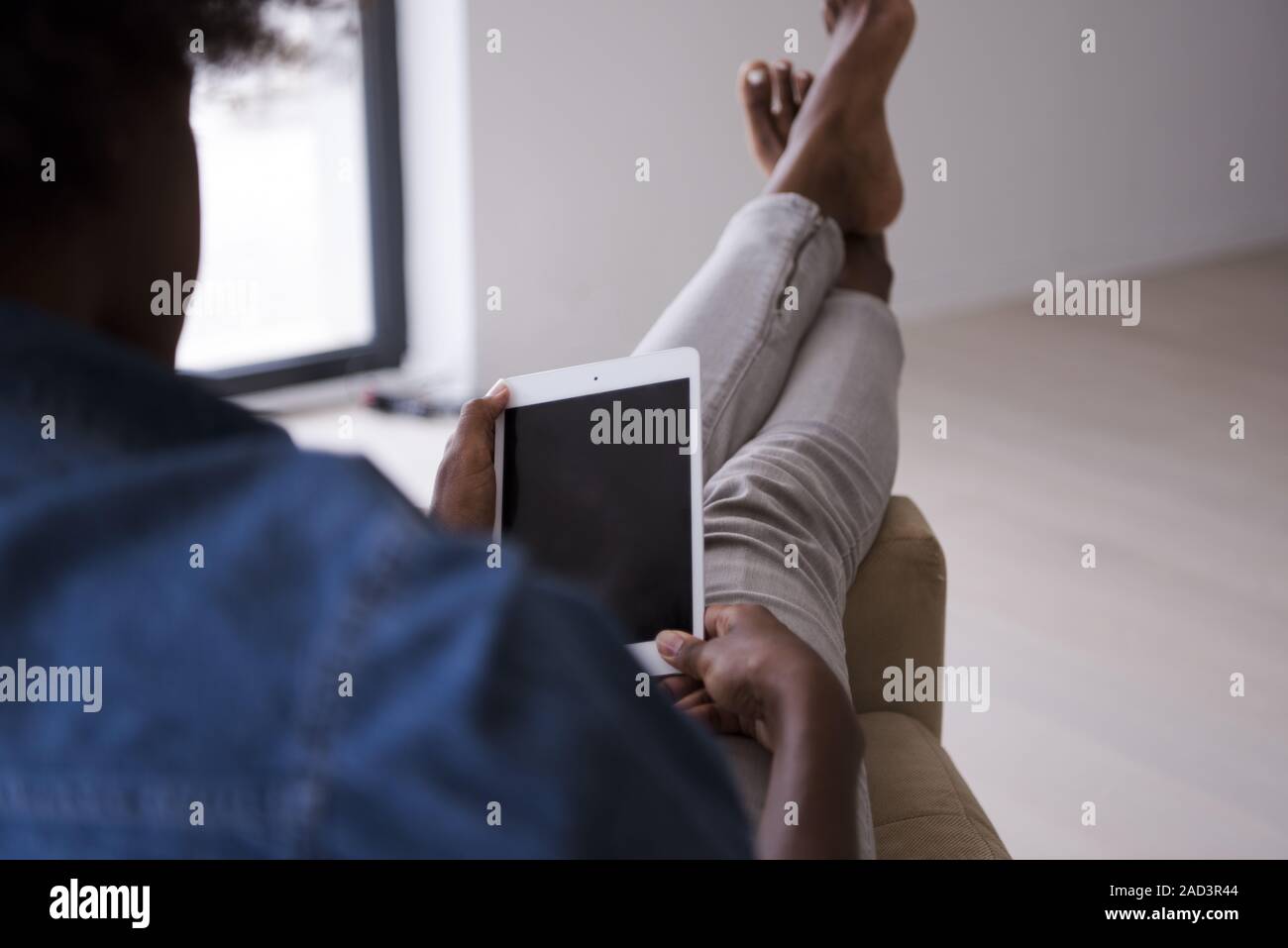 african american woman at home with digital tablet Stock Photo - Alamy