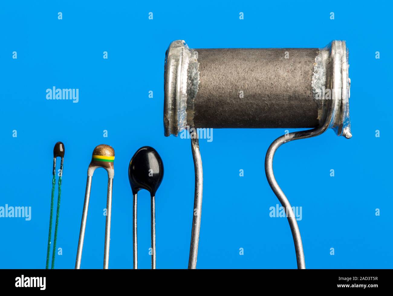 Four thermistors. Left to right are; a bead thermistor, a bead