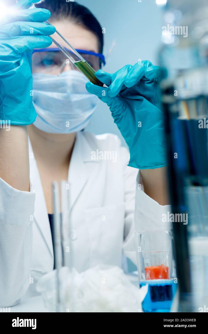 Young scientist with test tubes Stock Photo