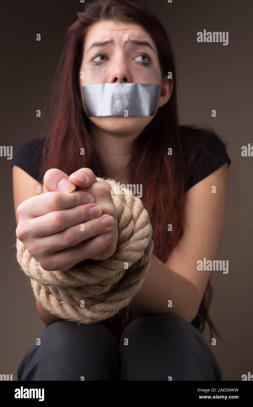 Crying woman with tied hands Stock Photo