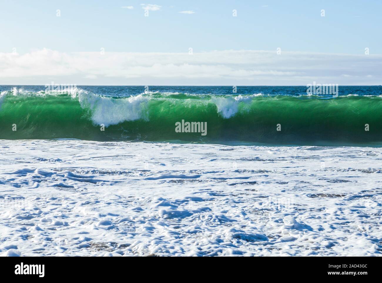 A translucent breaking wave on Baker Beach, San Fransisco, California, USA. Stock Photo