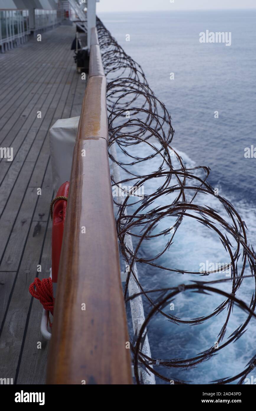 Razorwire deterring pirates from boarding a cruise ship off Africa Stock Photo