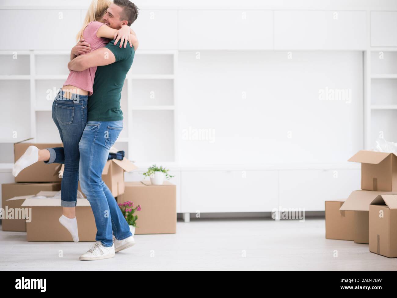 happy Young couple moving in new house Stock Photo - Alamy