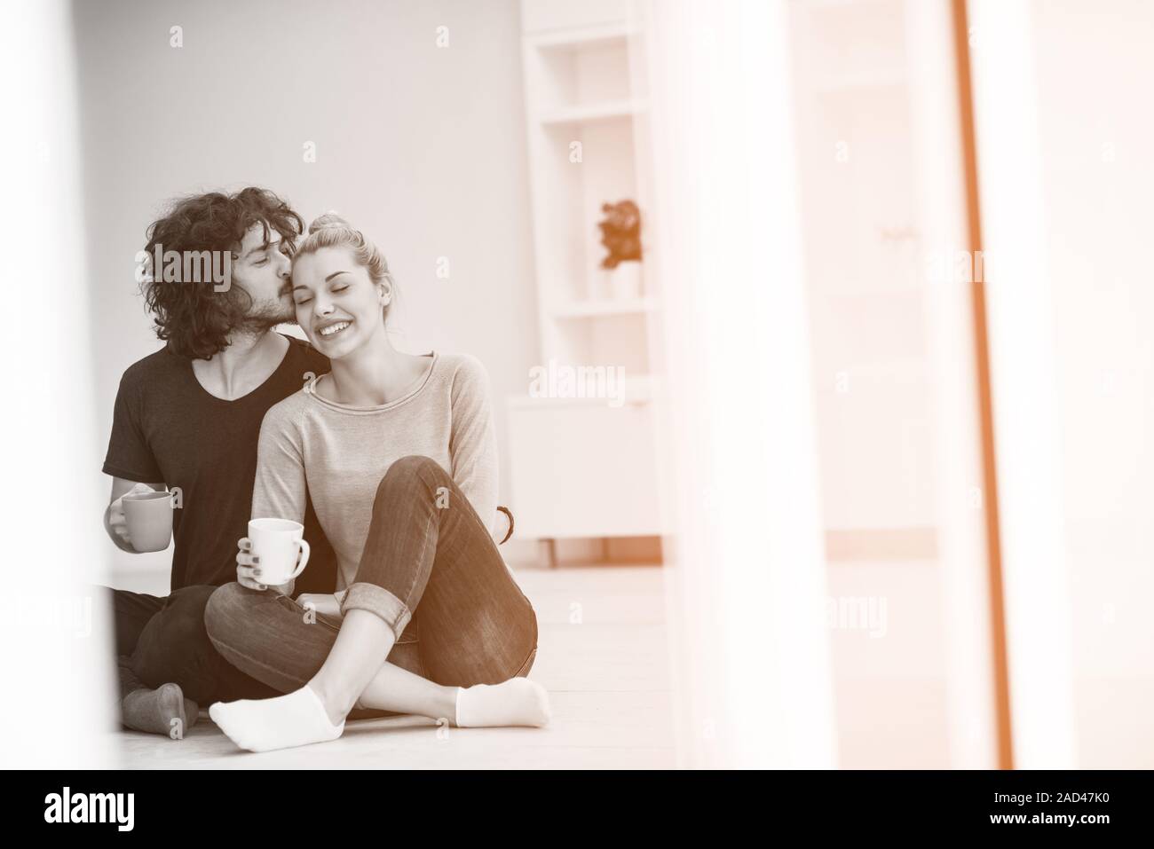 young couple in their new home Stock Photo - Alamy