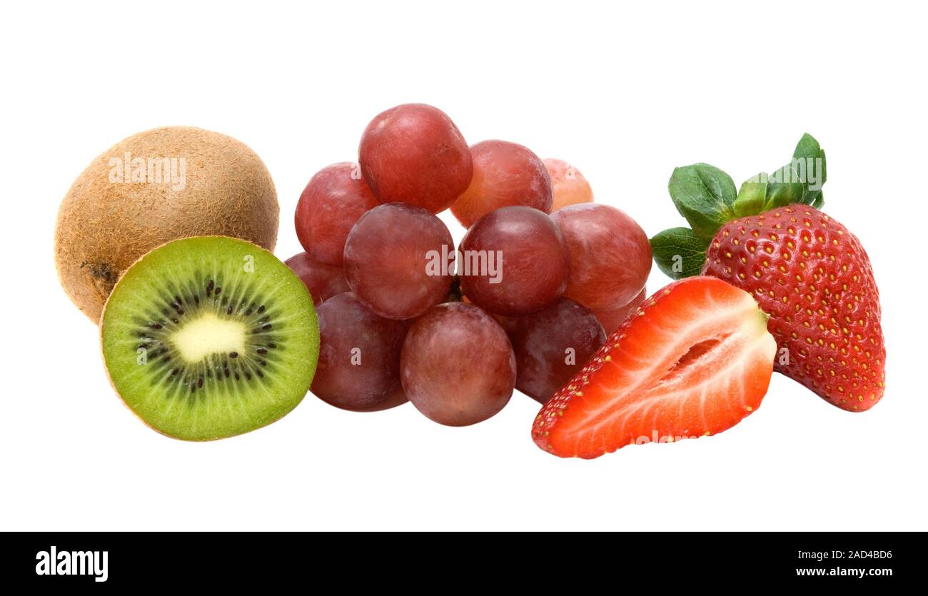 Kiwi, gtapes, and strawberries isolated on white background Stock Photo