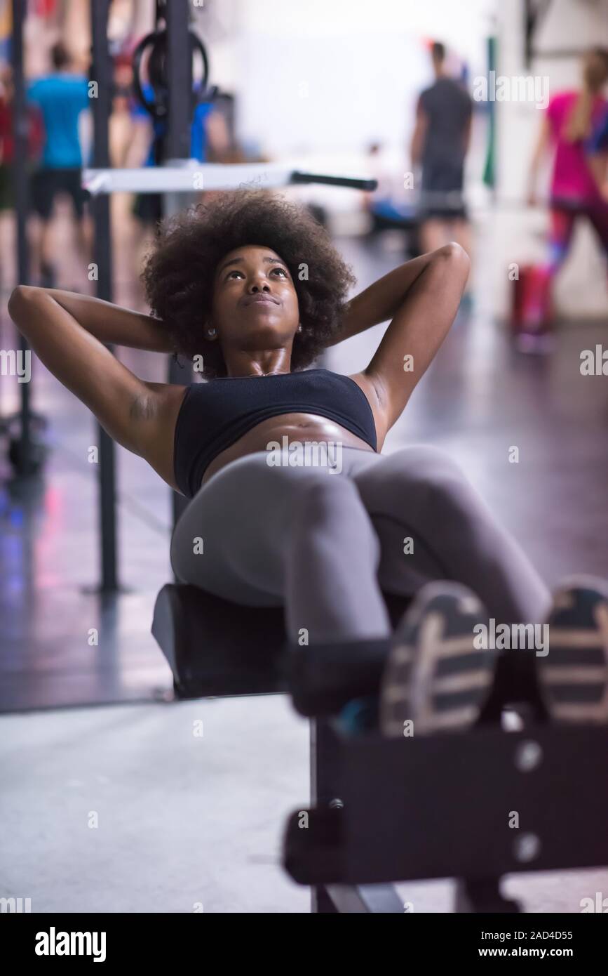 African american woman doing sit ups hi-res stock photography and ...