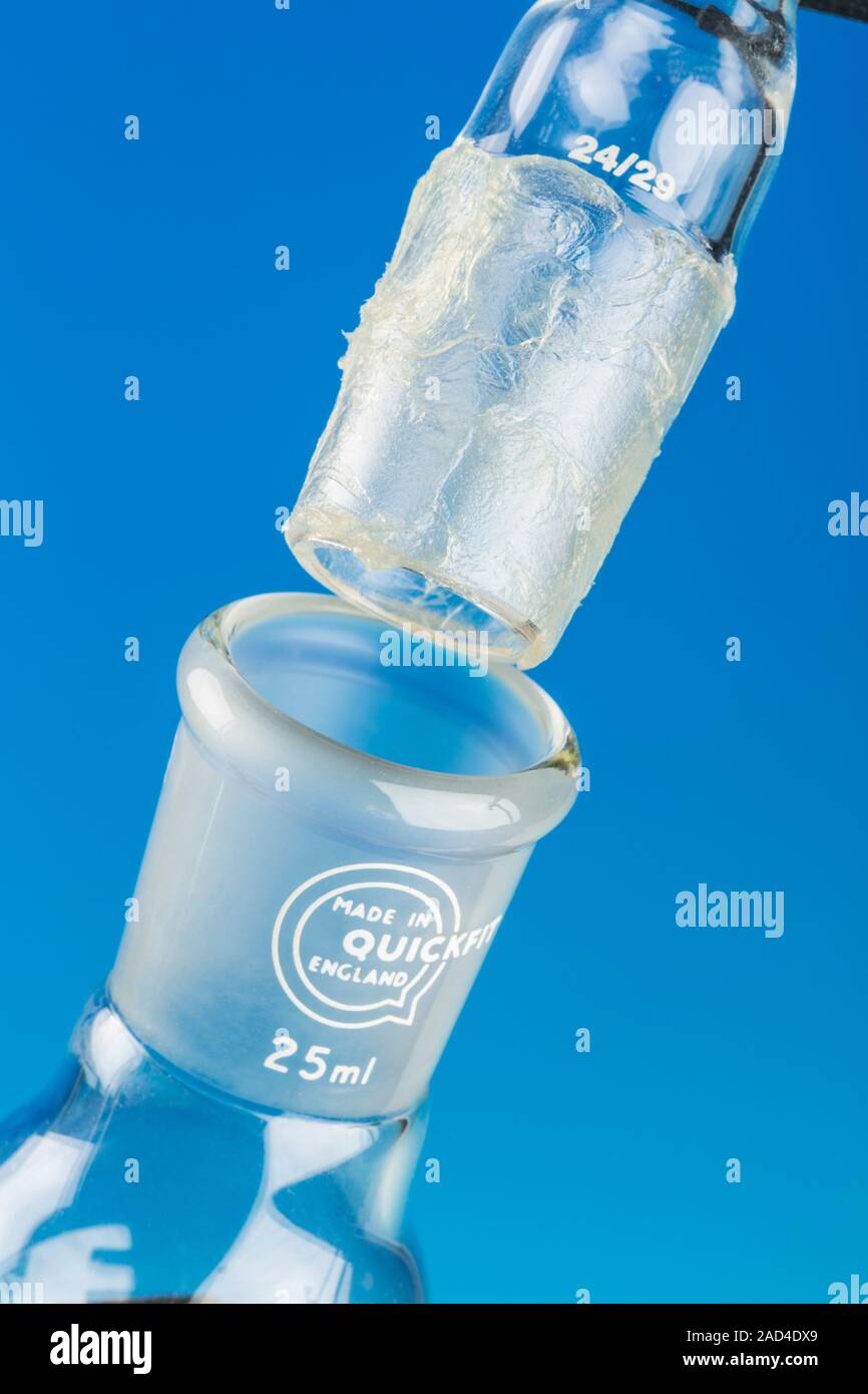 Laboratory glassware male joint coated in petroleum jelly. This