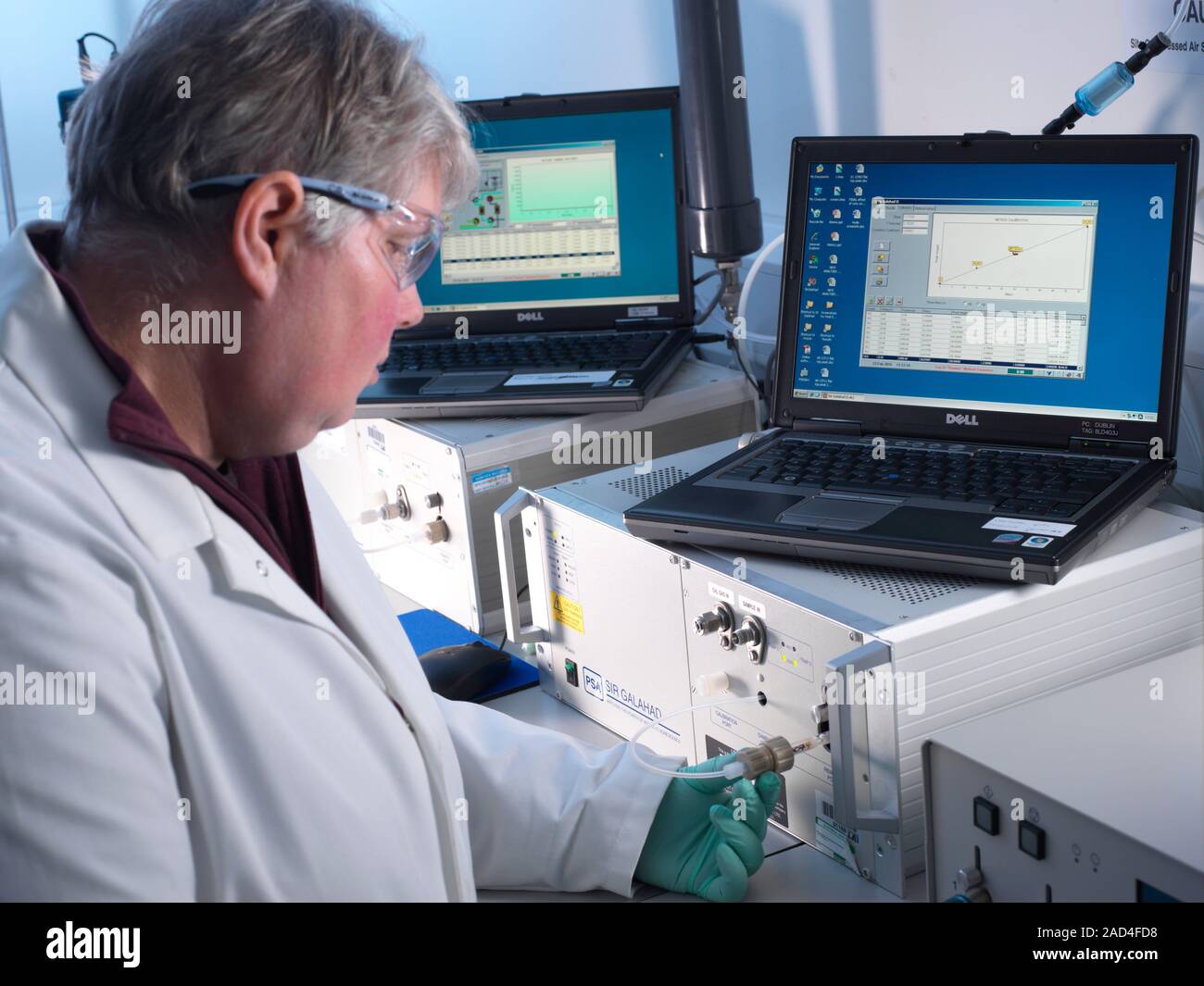Atomic fluorescence spectroscopy. Researcher using two atomic