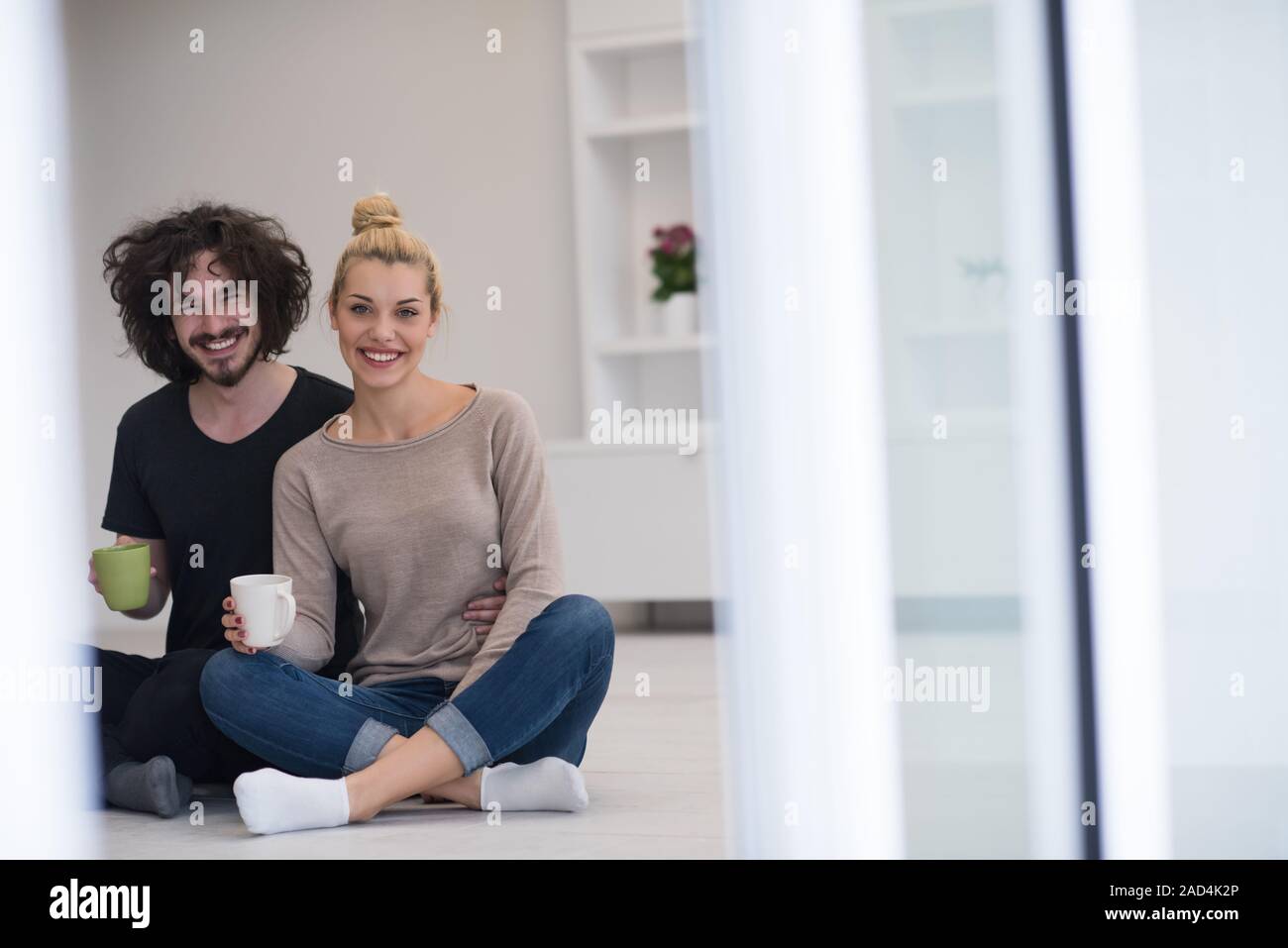 young couple in their new home Stock Photo - Alamy