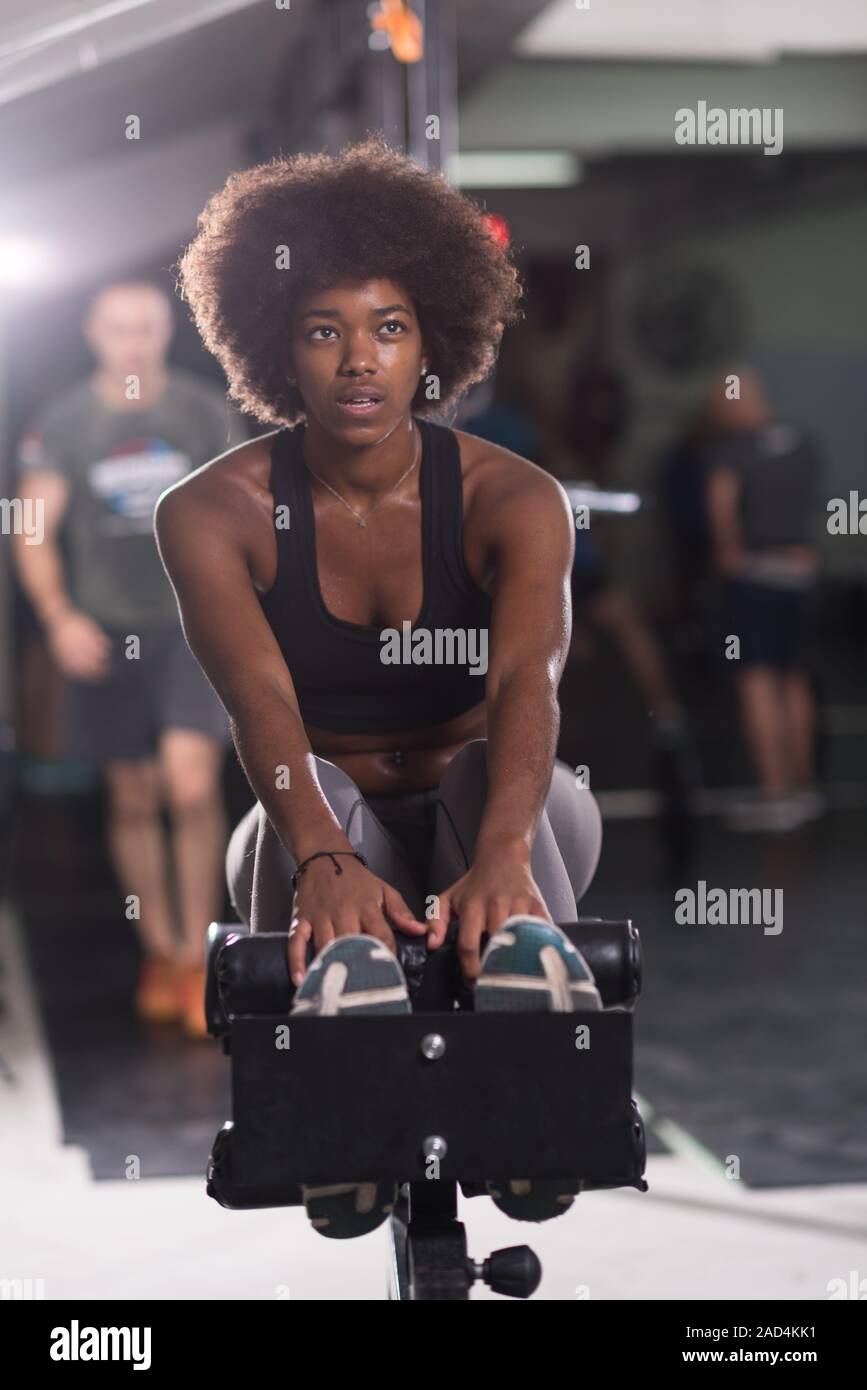 African american woman doing sit ups hi-res stock photography and ...