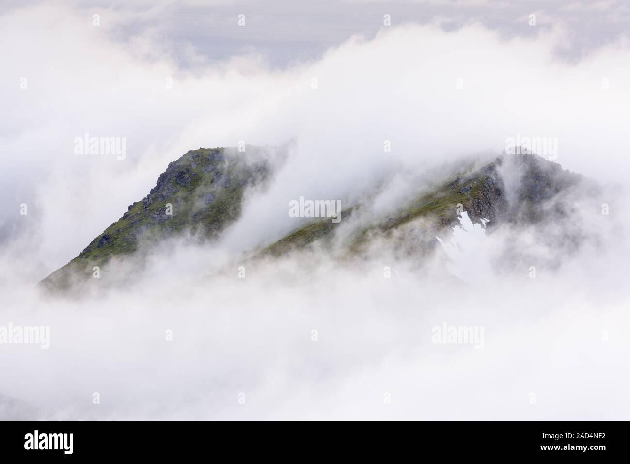 Foggy mood in the mountains, Flakstadsoeya, Lofoten, Norway Stock Photo