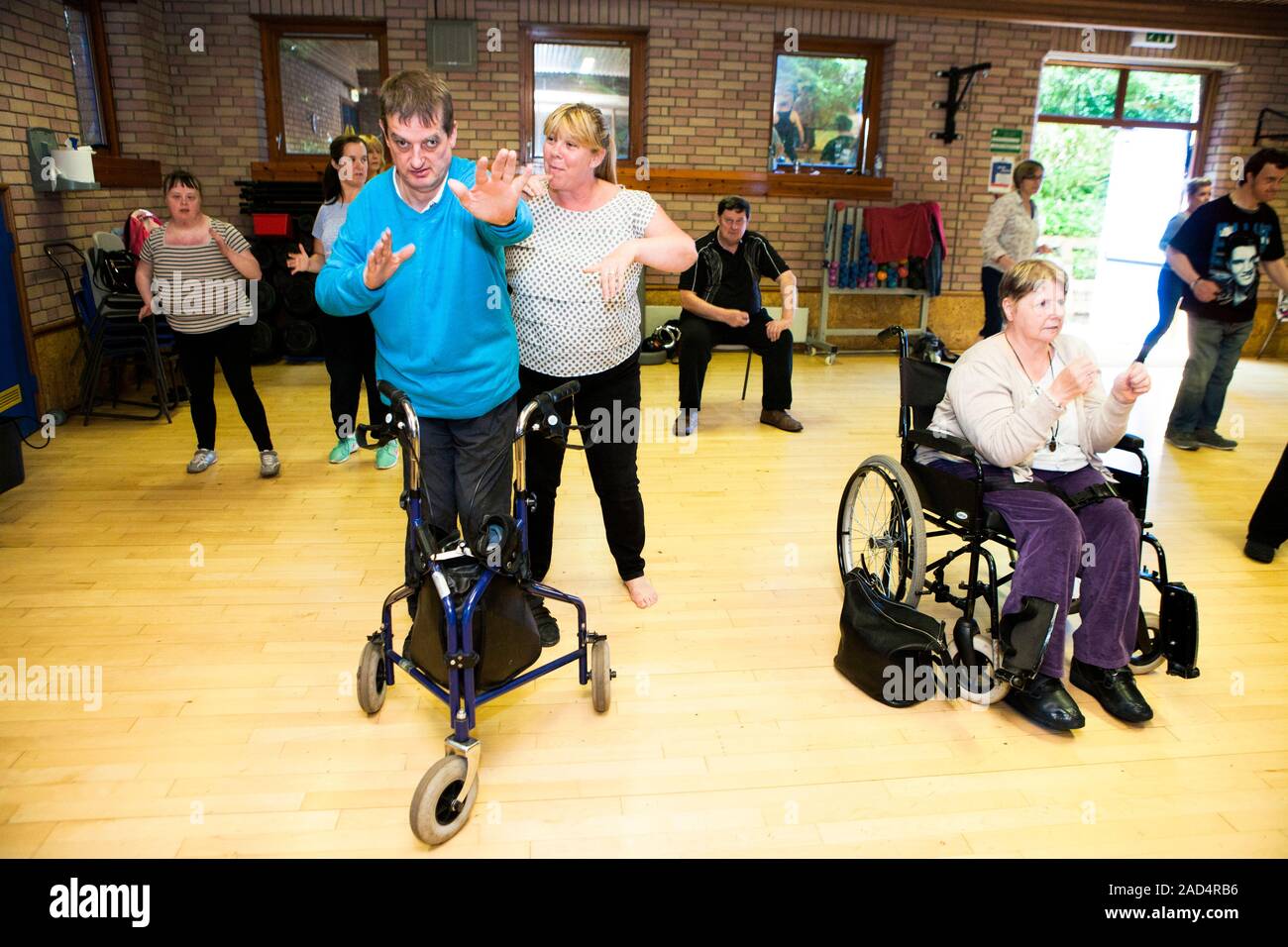 Exercise class for disabled people. Group of people with physical and